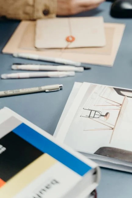 A stylish workspace featuring a laptop and monitors displaying design software.